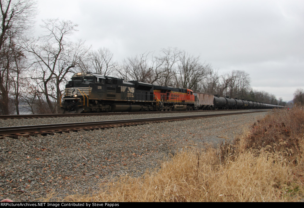 NS 1218 and BNSF 7749 with an oil train